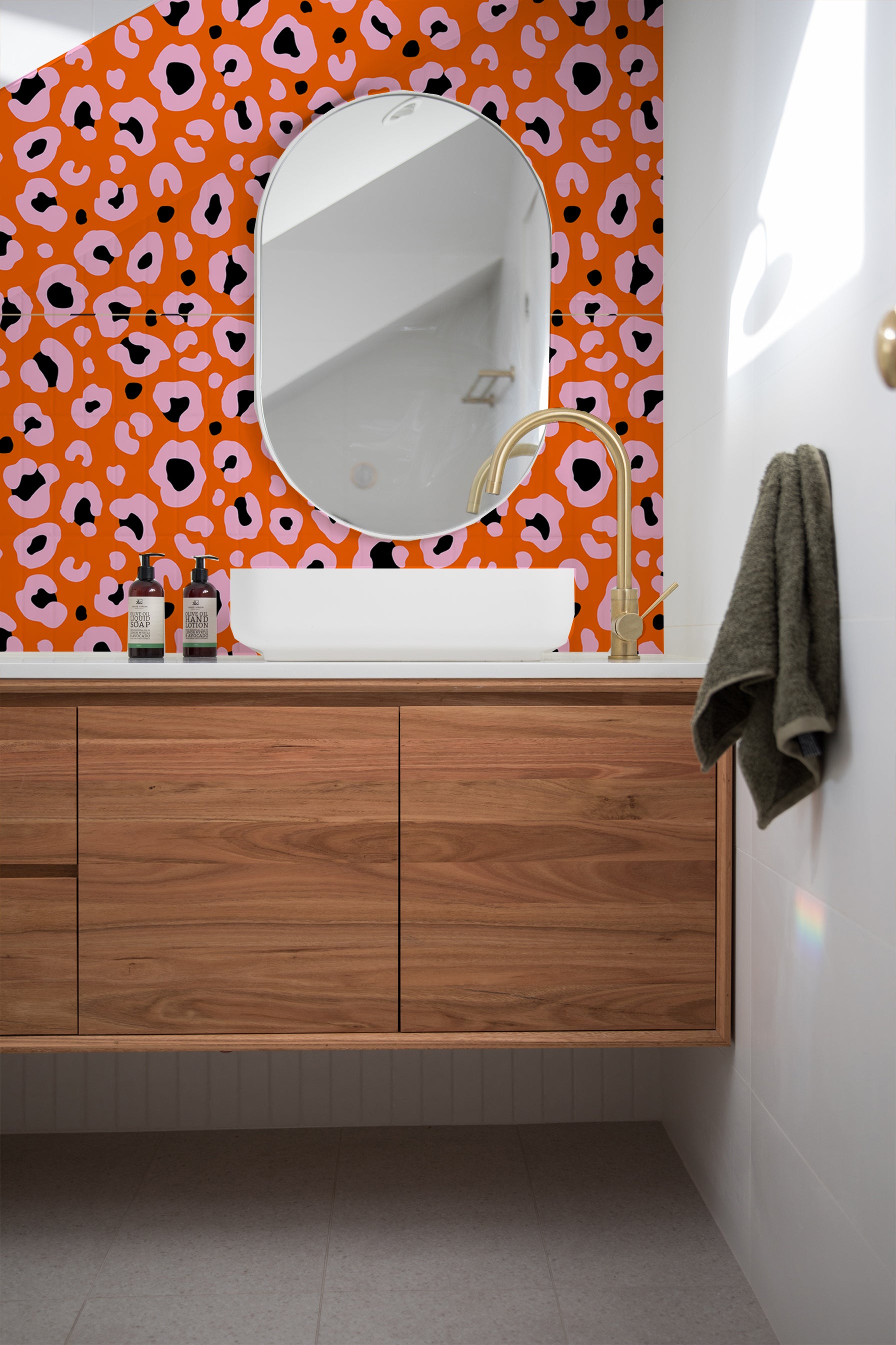 Orange and pink wallpaper in bathroom