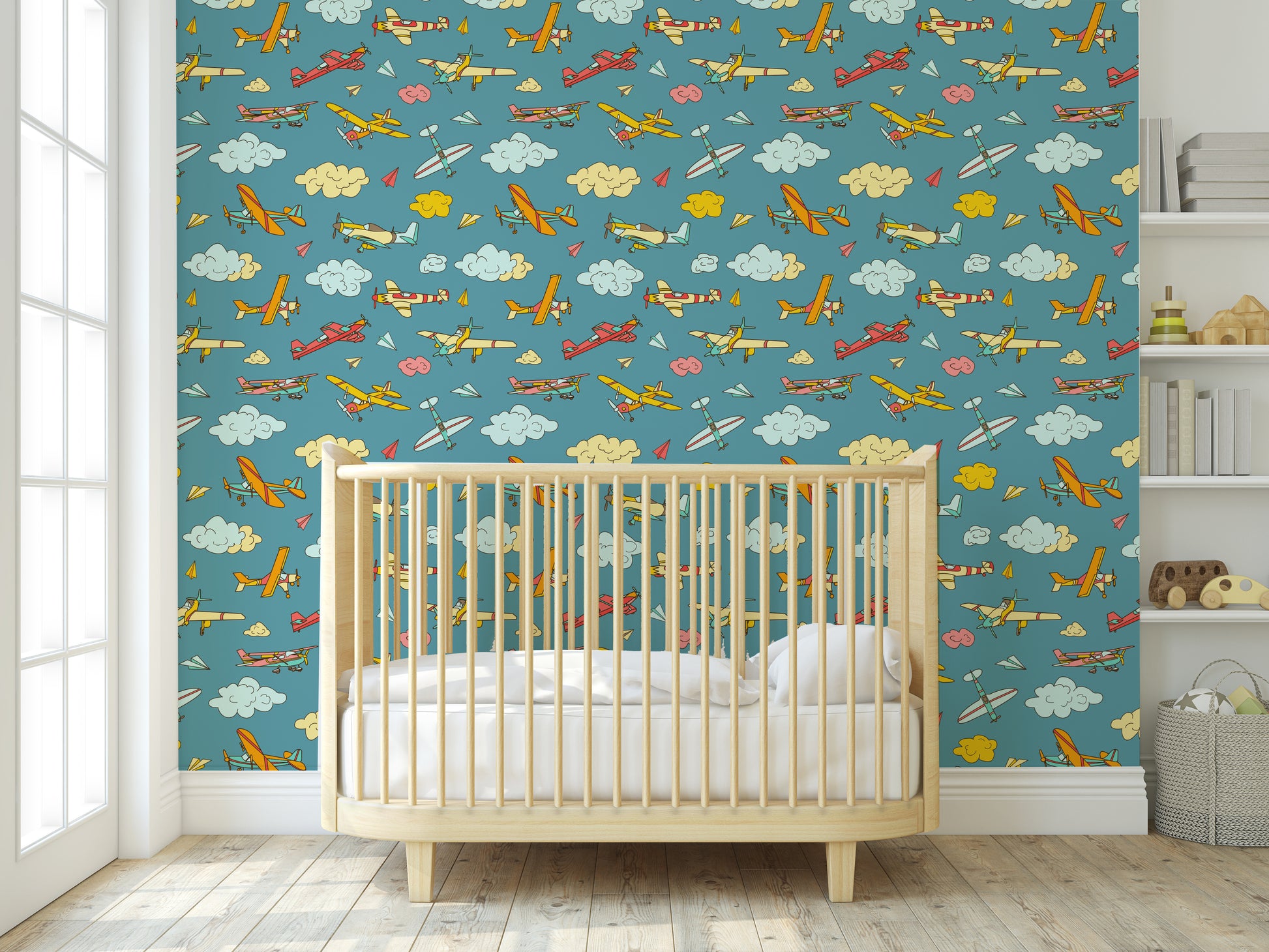 Colorful airplane removable peel and stick wallpaper in a infants nursery.